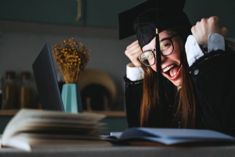 happy-young-caucasian-woman-celebrating-college-graduation